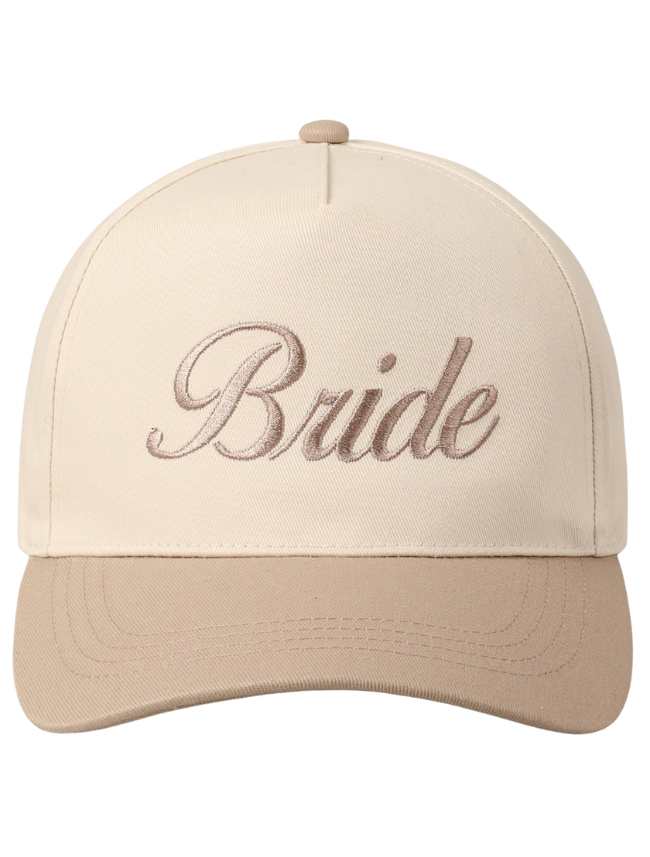 White and beige two-tone trucker hat with “BRIDE” embroidered in bold, uppercase lettering on the structured front panel.