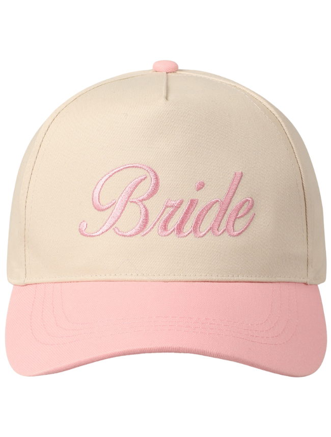 White and pink two-tone trucker hat with “BRIDE” embroidered in bold, uppercase lettering on the structured front panel.