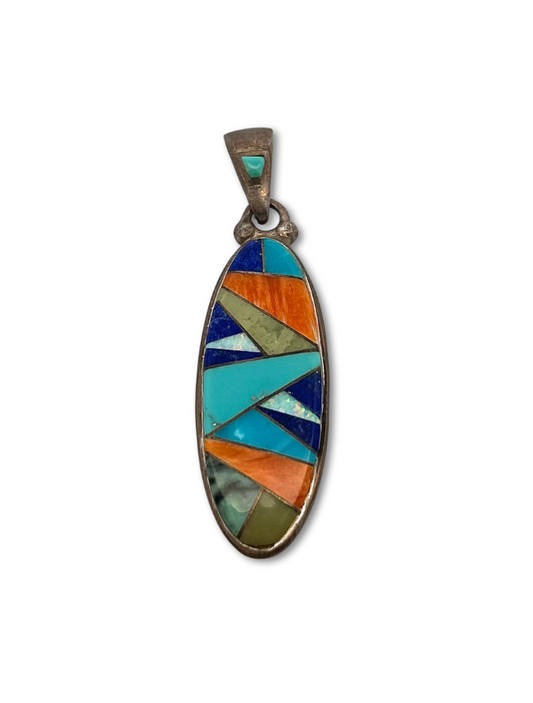 Top, front view of sterling silver multicolor inlay pendant