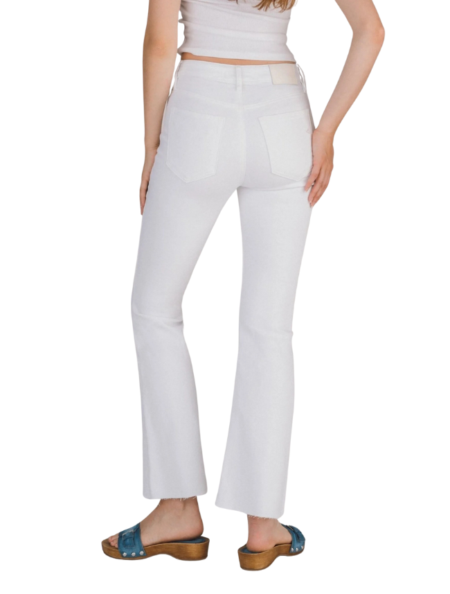 White pants worn by a person on a white background