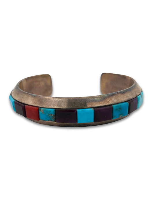 Front view of Michael Dukepoo sterling silver turquoise/coral/sugilite cuff bracelet
