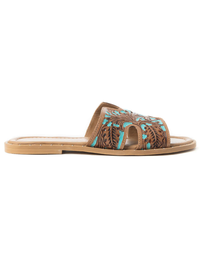 Brown sandal with turquoise floral tooling on a white background