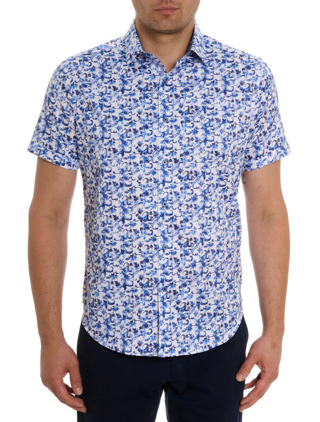 Man wearing a blue and white patterned shirt on a white background