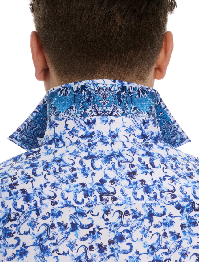 Blue and white patterned shirt worn by a person on a white background