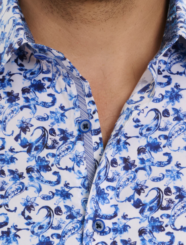 Close-up of a person wearing a blue and white patterned shirt.