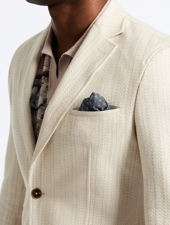 Close-up of Robert Graham men's blazer fabric – textured woven material in lightweight construction.