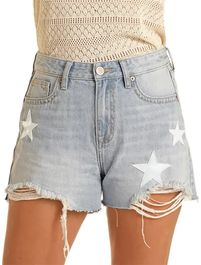 Denim shorts with star patterns and distressed edges on a white background