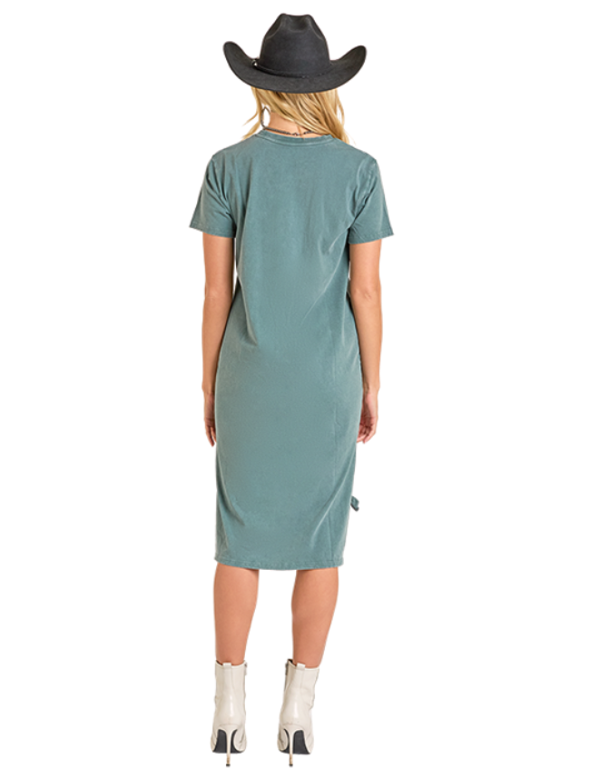 Woman wearing a teal dress and black cowboy hat on a white background