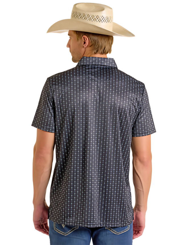Man wearing a grey polo with geometric print on a white background.