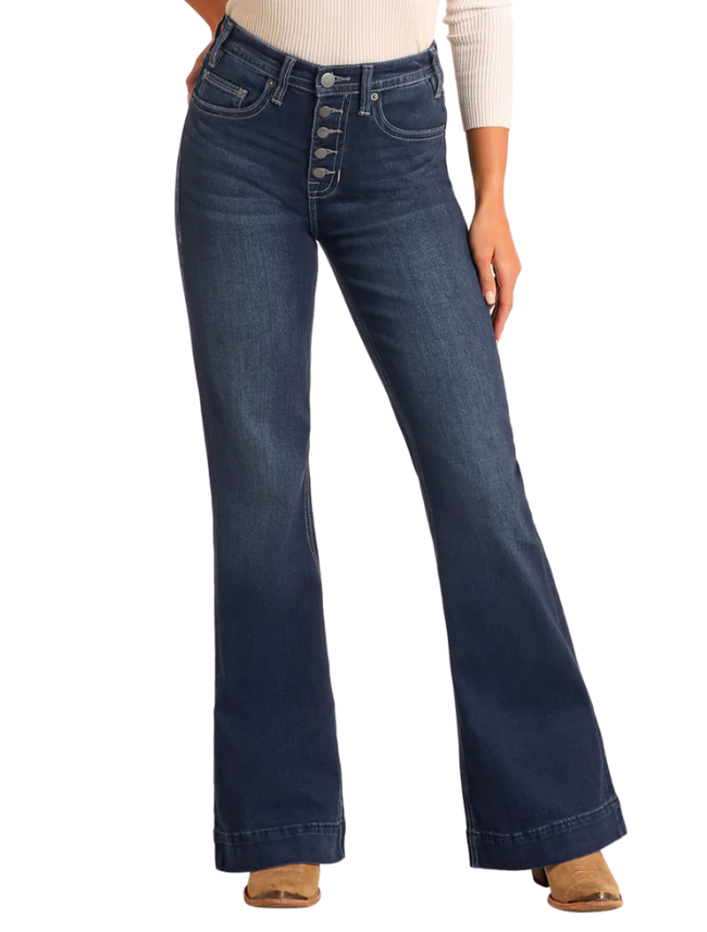 Blue flared jeans worn by a person on a white background
