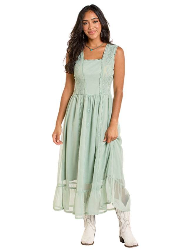 Woman wearing a light green dress with a white background
