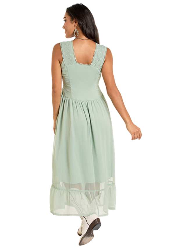 Woman wearing a light green dress with a white background