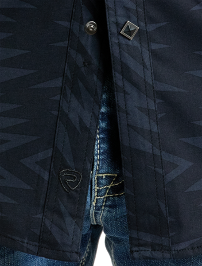 Front, close up view of the Rock & Roll Denim Men's Long Sleeve Aztec Print Western Snap Shirt with emphasis on aztec pattern, snap buttons, and black brand emblem