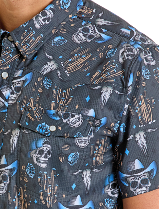 Front, close up on shoulder of Rock & Roll Denim Men's Skull Print TEK Western Snap Shirt with emphasis on cowboy skull and cactus print