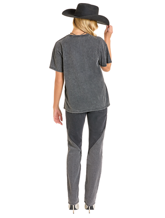 Woman wearing a gray oversized t-shirt with a wide-brimmed hat on a white background