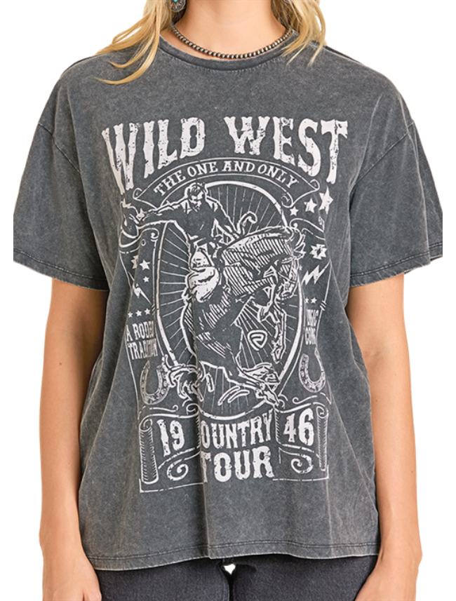 Woman wearing a 'Wild West' themed t-shirt with graphic bronco rider design and text.