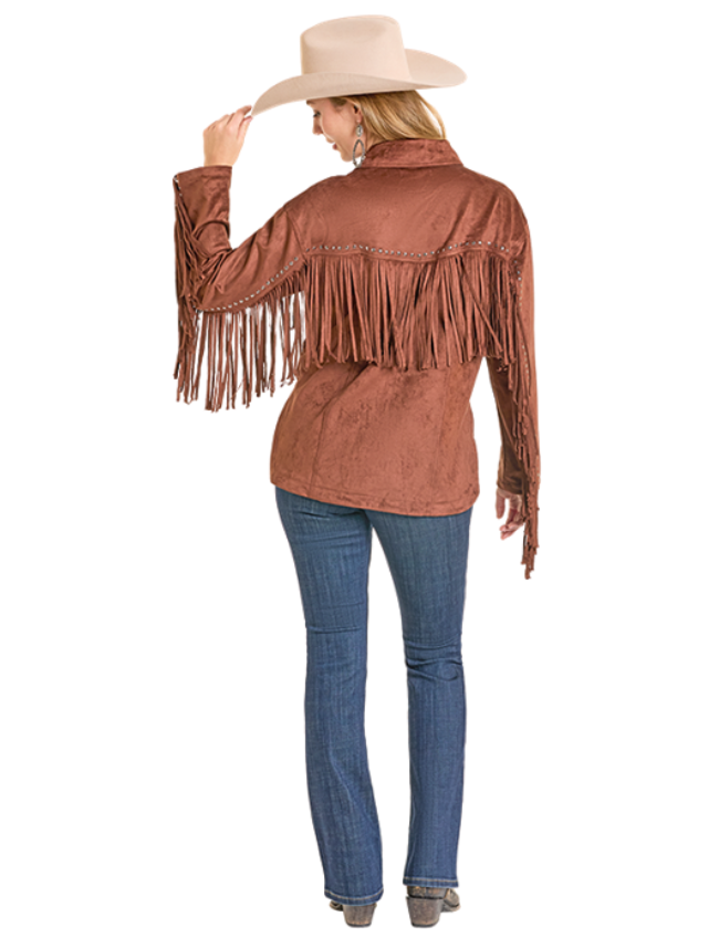 Woman wearing a brown fringed jacket and blue jeans on a white background