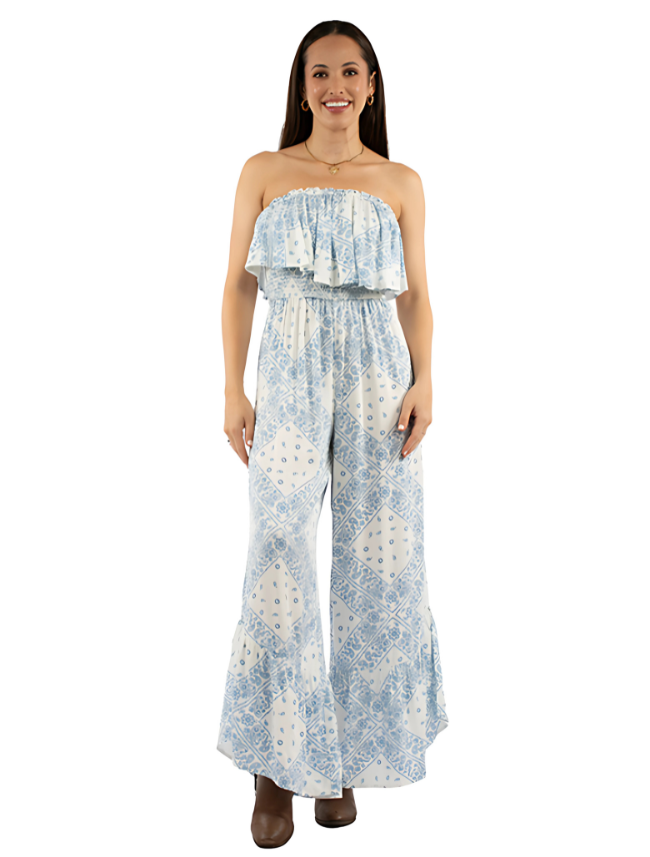 Woman wearing a strapless floral jumpsuit on a white background