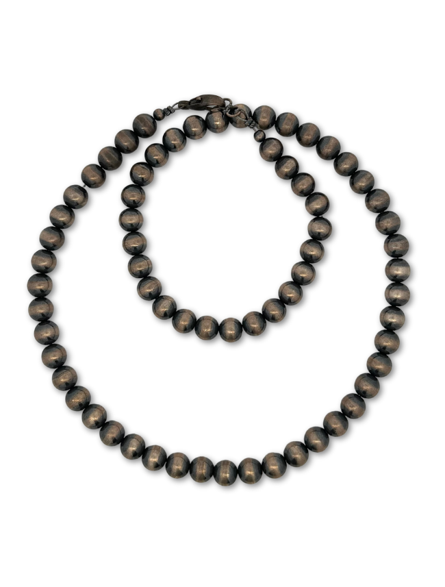 Top down view of sterling silver beaded necklace