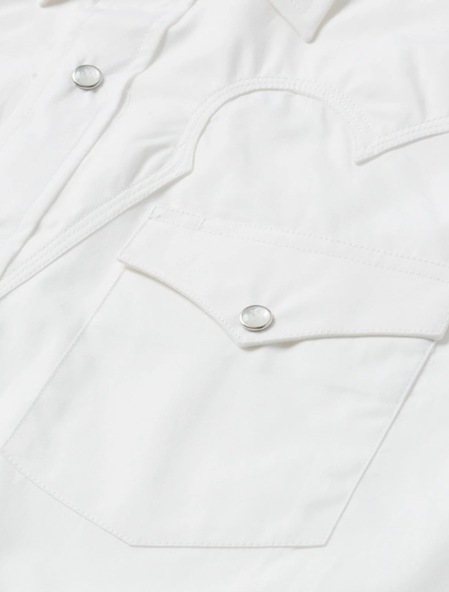 Close-up of a white shirt with button details