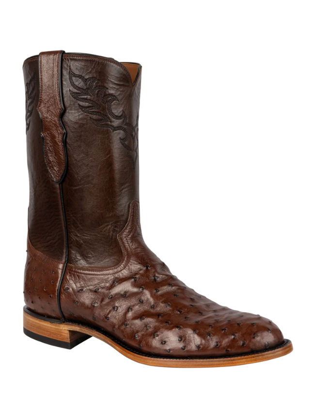 Brown leather boot with detailed design on a white background