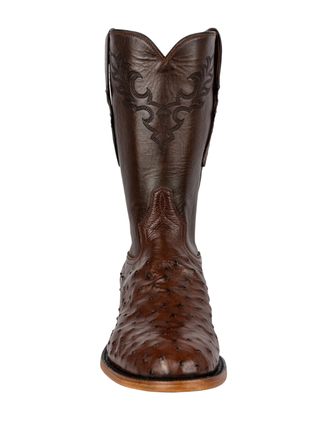 Brown cowboy boot with detailed design on a white background