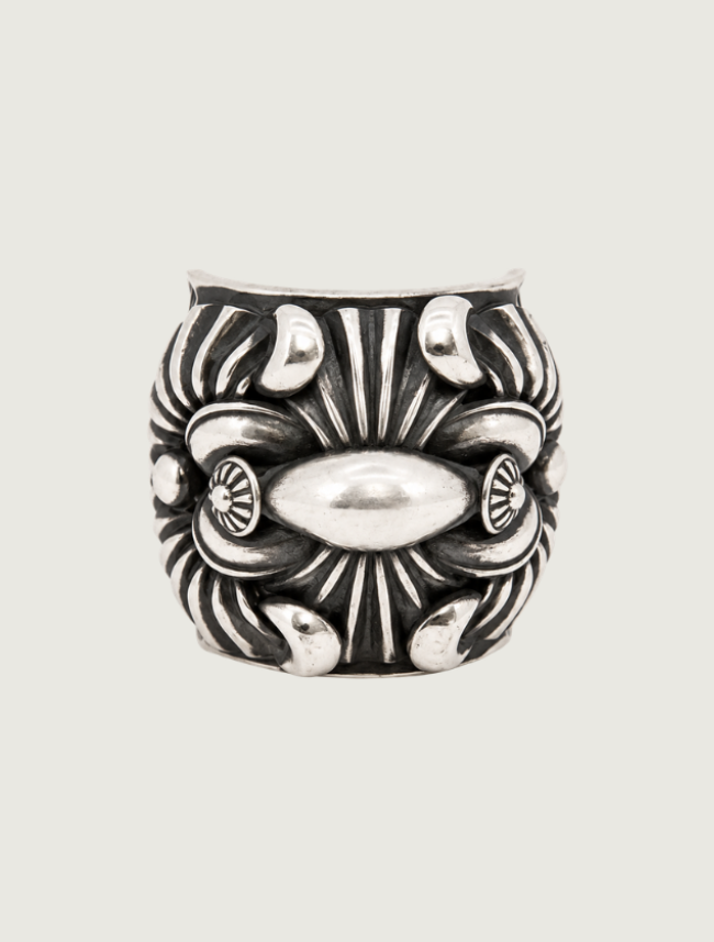 Delbert Gordon sterling silver statement ring, front view of elongated oval bar center with sunburst detail