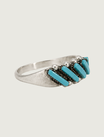 Quarter view of sterling silver Sleeping Beauty turquoise diagonal ring