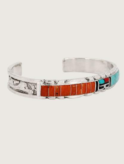 Quarter view of Don Dewa sterling silver sunface inlay cuff