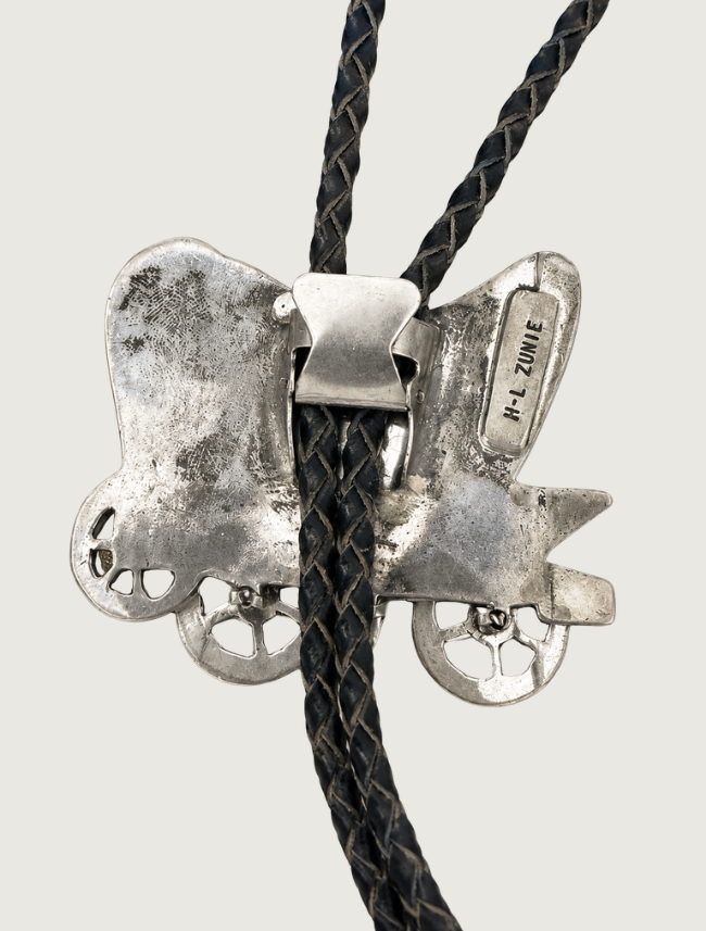 H.L. Zunie sterling silver covered wagon bolo tie, front view showing multi-stone inlay detail