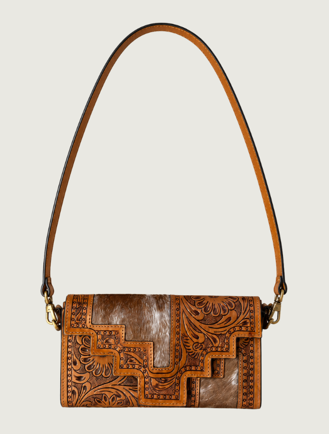 Tan tooled leather and cowhide crossbody bag, strap extended