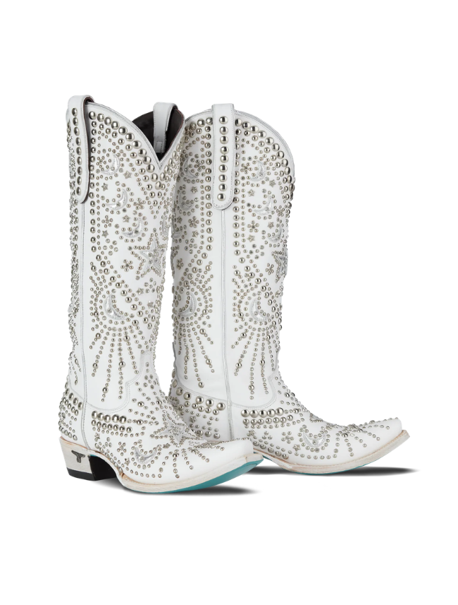 White cowboy boots with rhinestone detailing on a white background