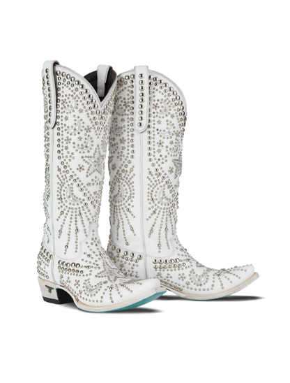 White cowboy boots with rhinestone detailing on a white background