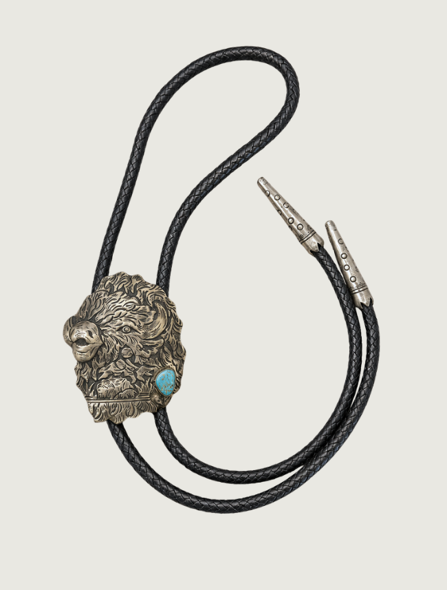 Richard Singer sterling silver buffalo bolo tie, full length view with braided black leather cord
