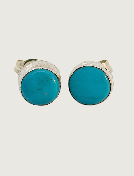 Front view of sterling silver Sleeping Beauty turquoise cabochon stud earrings