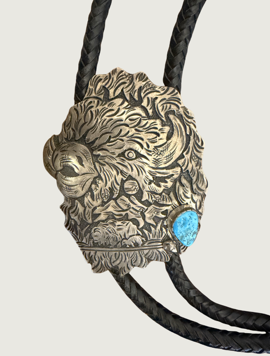 Richard Singer sterling silver repoussé buffalo head bolo tie slide with turquoise cabochon, detail view
