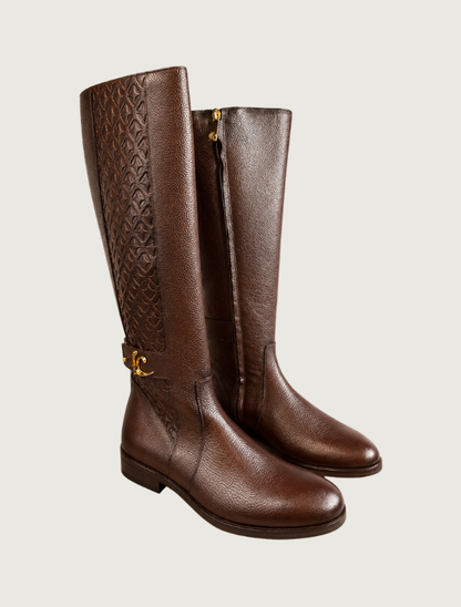 Pair of Cuadra brown riding boots, three-quarter view, showing the inside zipper and embossed outer panels