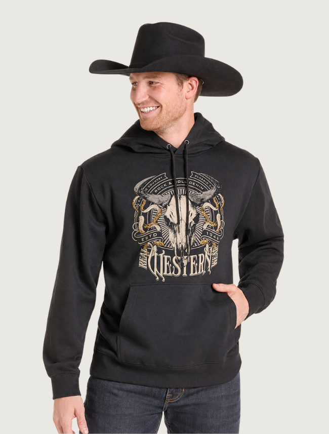 Man in a black cowboy hat wearing the black steer-skull Western graphic hoodie, front view