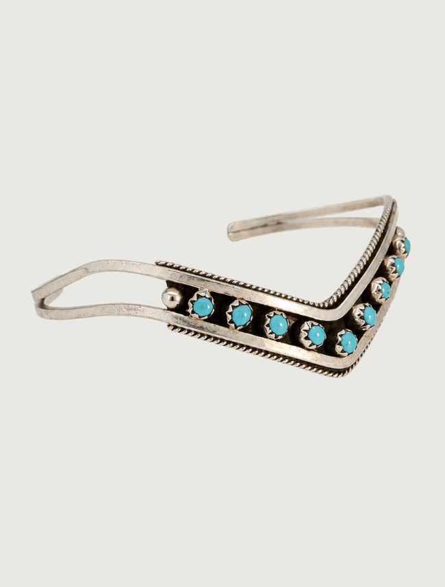 Side view of sterling silver Sleeping Beauty turquoise chevron cuff bracelet