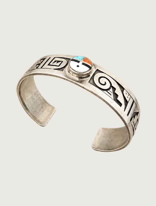 Sterling silver Sun Face Kachina cuff bracelet, side view showing shadow box overlay stampwork