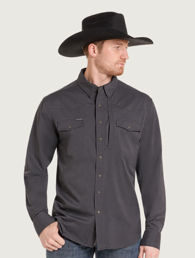 Man in a cowboy hat wearing the black snap shirt, three-quarter view
