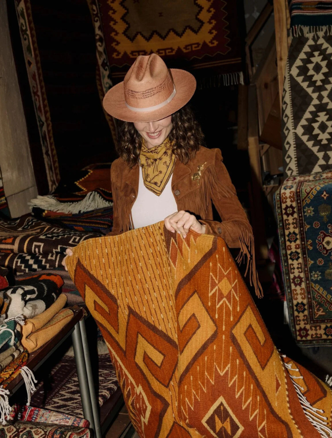 Stetson Redwood cowboy hat on female model in rug shop — front view