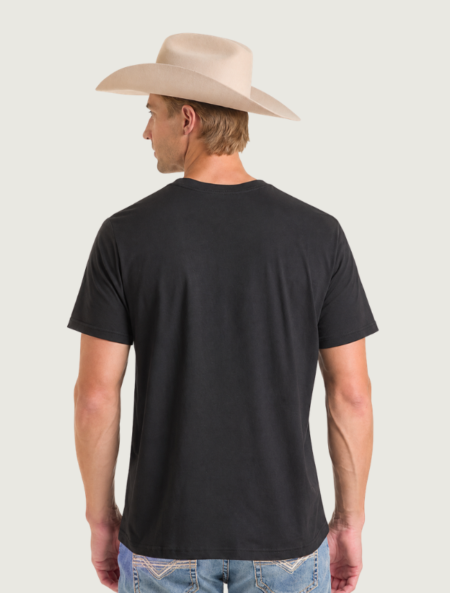Back view of the plain black tee worn by a man in a cowboy hat