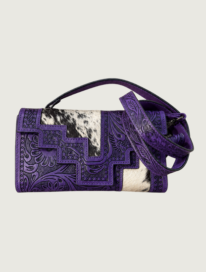 Purple tooled leather and cowhide crossbody bag, strap coiled