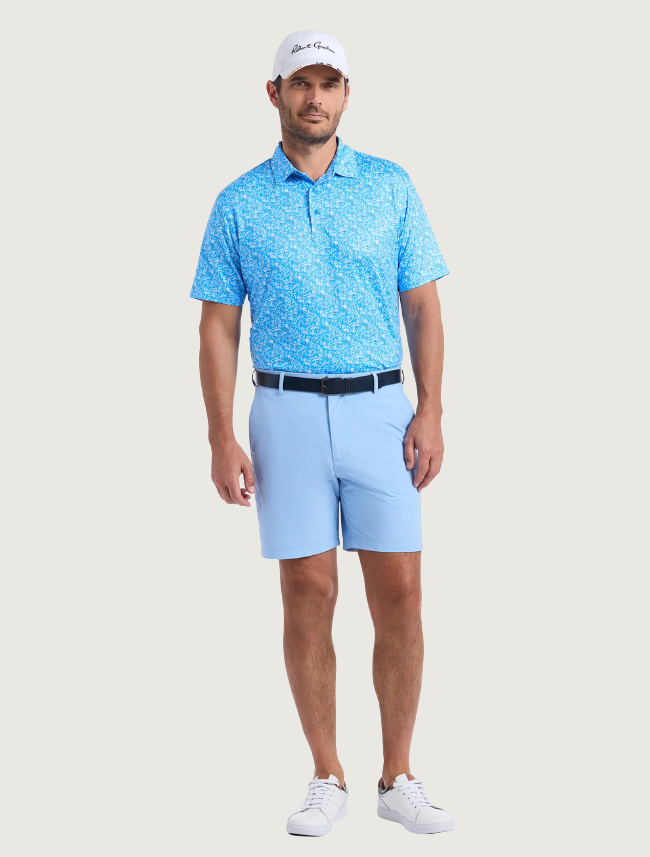 Robert Graham Ebford polo on model — full body view with light blue shorts