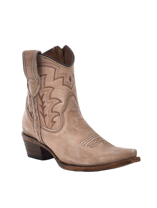 Tan cowboy boot with intricate stitching on a white background