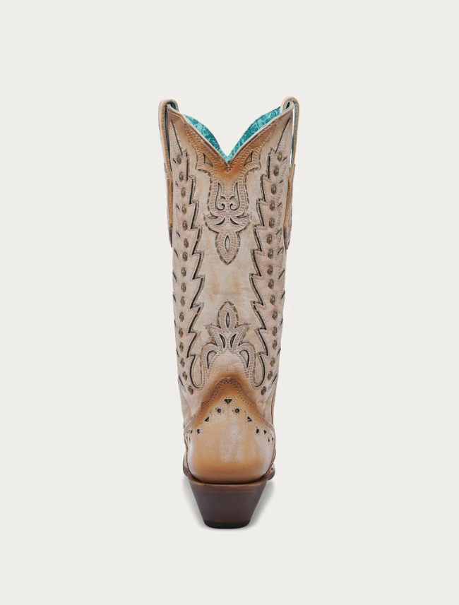 Cowboy boot with intricate design on a white background