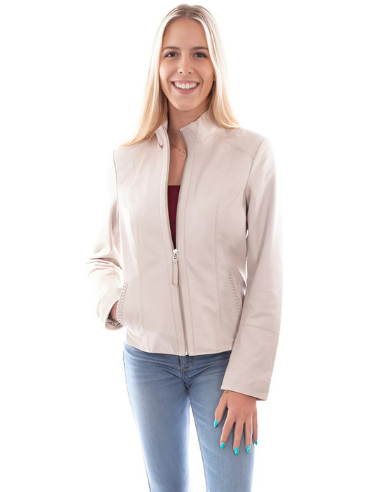 A woman wearing a beige zip front leather jacket with a stand up collar, two lower diagonal welt pockets, and paired with blue jeans.