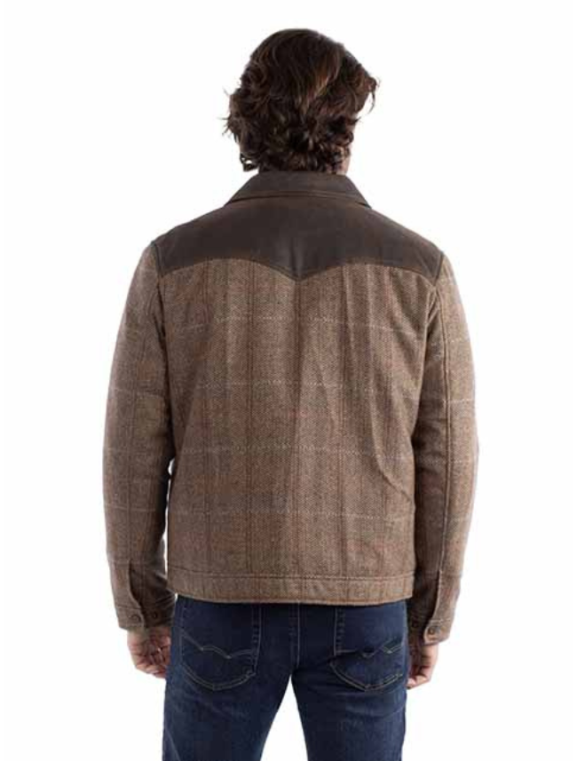 Man wearing a brown checkered jacket with leather accents on a white background