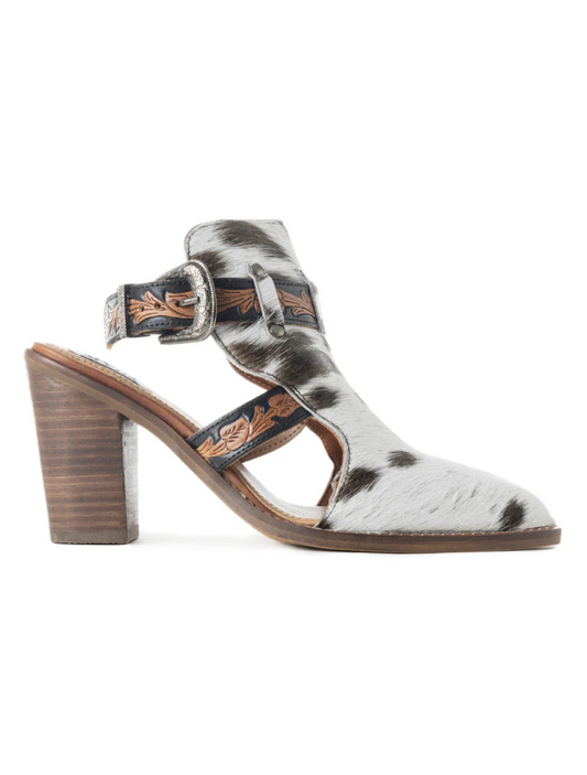 Cow print open bootie with wooden heel on a white background